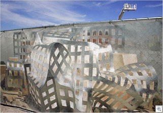 A rendering of the Lou Ruvo Brain Institute, designed by Frank Gehry, covers the fence surrounding the building’s construction site at Union Park in Las Vegas.  Leila Navidi/Las Vegas Sun