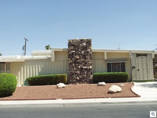 Battens create a verticle line to offset the classic mid mod rooflne of this home in Paradise Palms