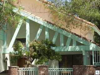 Exposed beams can add some heft and fill in a gap without blocking the light.