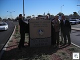 City Manager Doug Selby, Gary Reese, John Delikanakis and Southridge President Michael Hanratty Unveil the Monument Sign