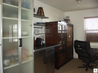 Ikea kitchen with pantry and stainless wrapped cabinets