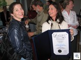 Artist Catherine Berg with the certificate of Appreciation from  The City Of Las Vegas and Mayor Oscar Goodman 