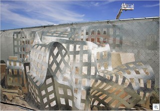 A rendering of the Lou Ruvo Brain Institute, designed by Frank Gehry, covers the fence surrounding the building’s construction site at Union Park in Las Vegas. Leila Navidi/Las Vegas Sun