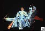 Liberace on stage wearing Glittering Costume